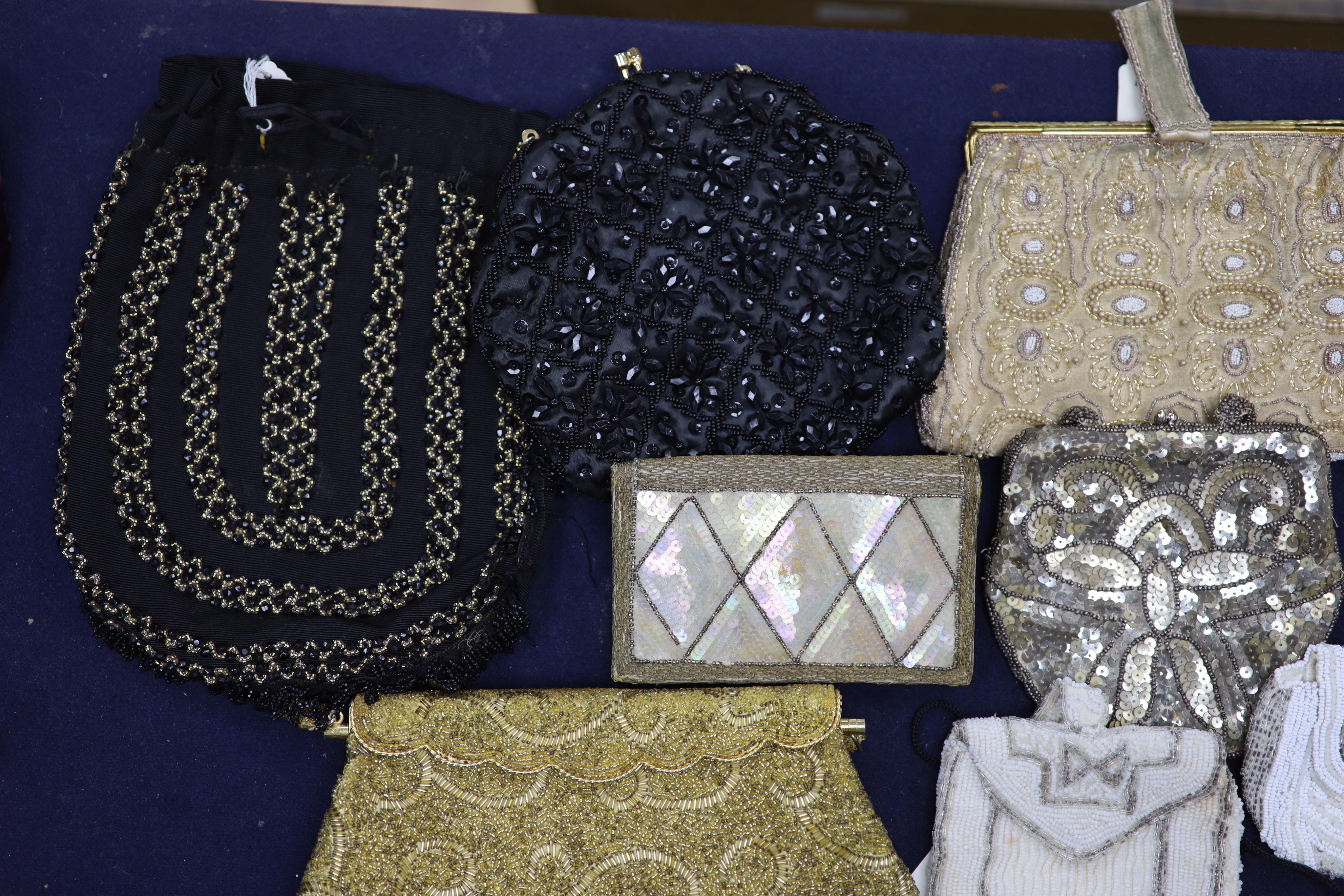 A collection of approximately fifty Victorian and later beadwork, white metal and fabric purses etc.